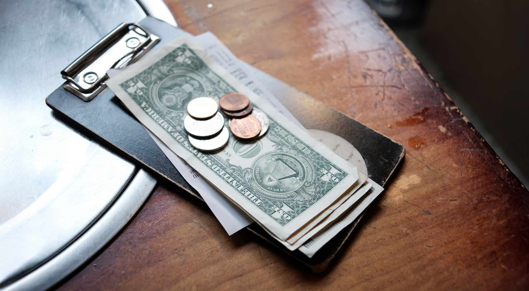 A tip is left on a table at a restaurant.