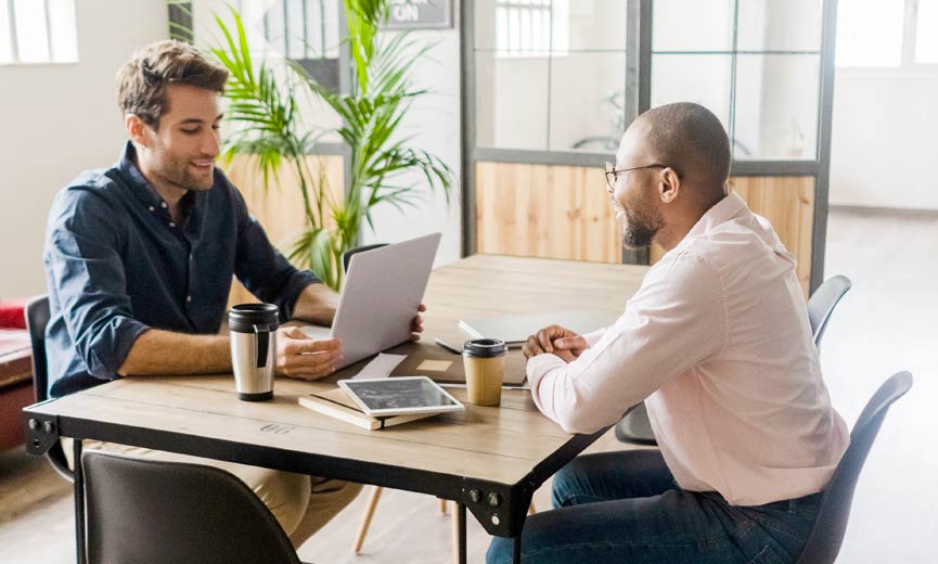 An employer discusses his company's retirement plan with an employee.