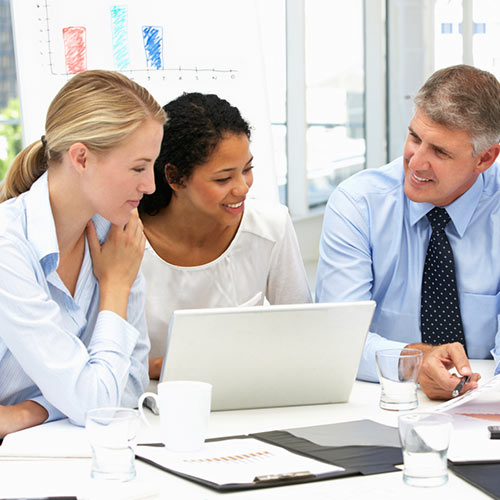 group of professionals at a desk