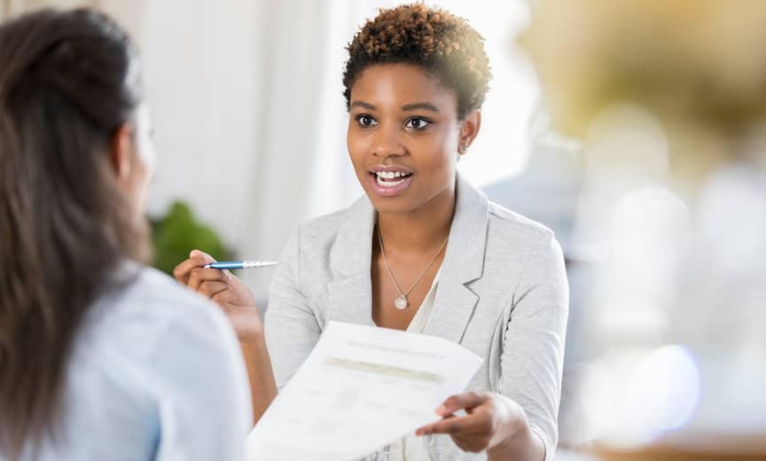 business women discussing safe harbor 401k plans