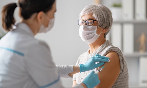 Woman receiving vaccine