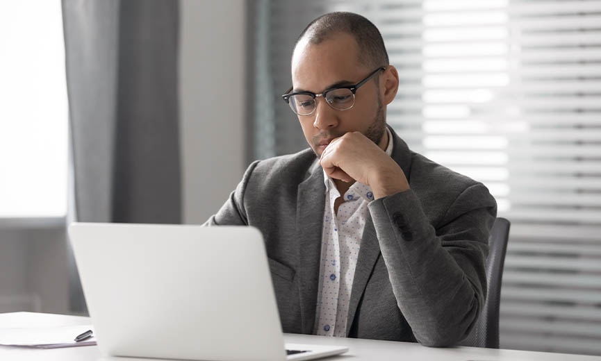 Business owner reviewing information on his computer