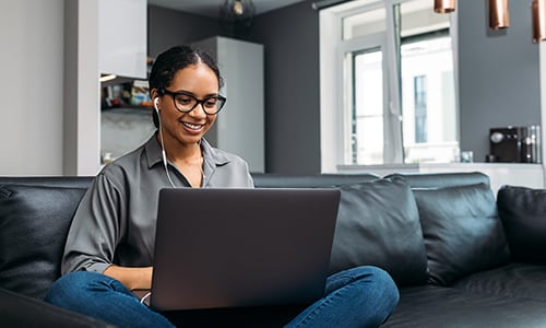 Woman working on laptop at home