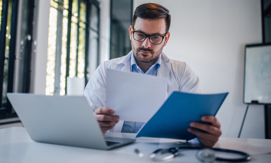 Doctor looking over medical records