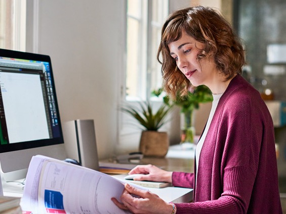 self-employed woman reviewing employment taxes