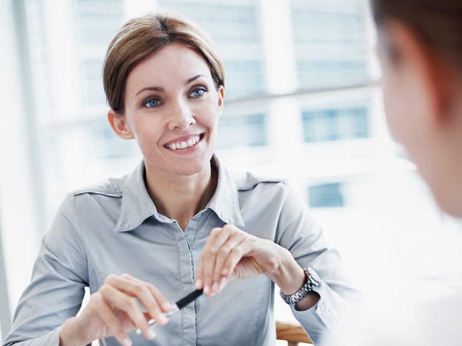 woman discussing retirement benefits with employee