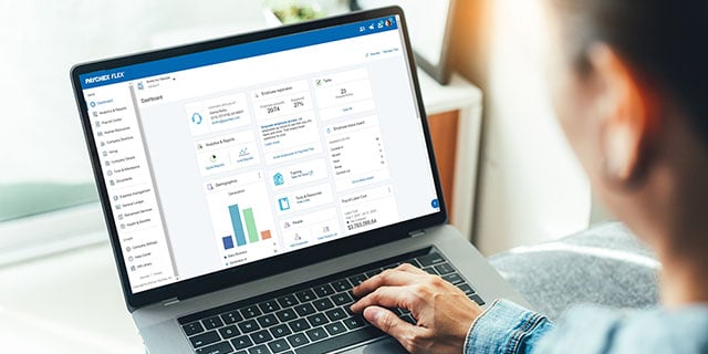  an hr manager using Paychex flex on his laptop