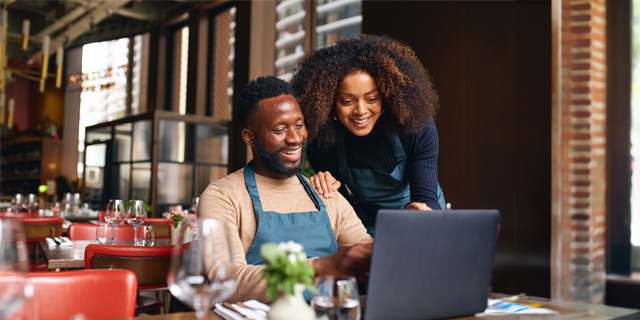 Restaurant owners working on the computer