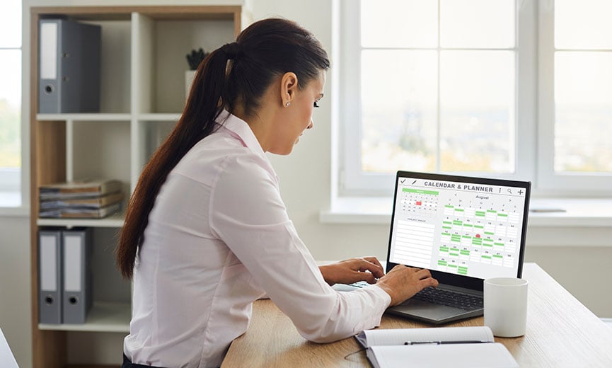 A business owner manages time off requests from employees