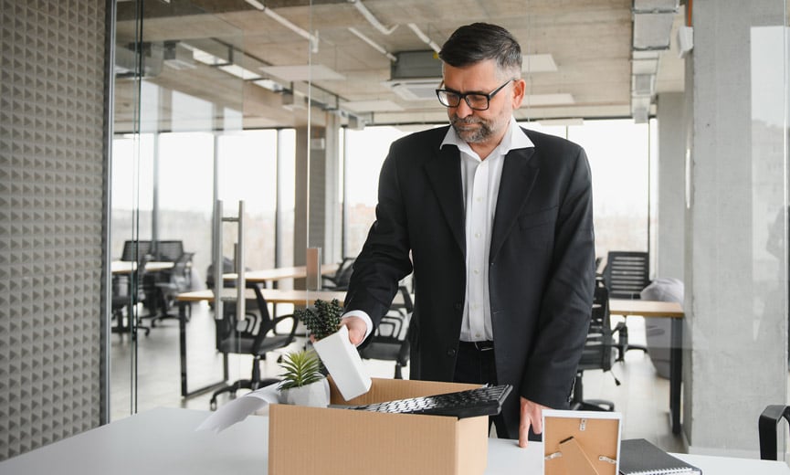 An employee cleaning out their desk after being terminated