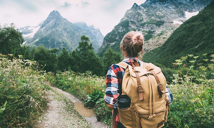 Young woman enjoying a hike in the woods