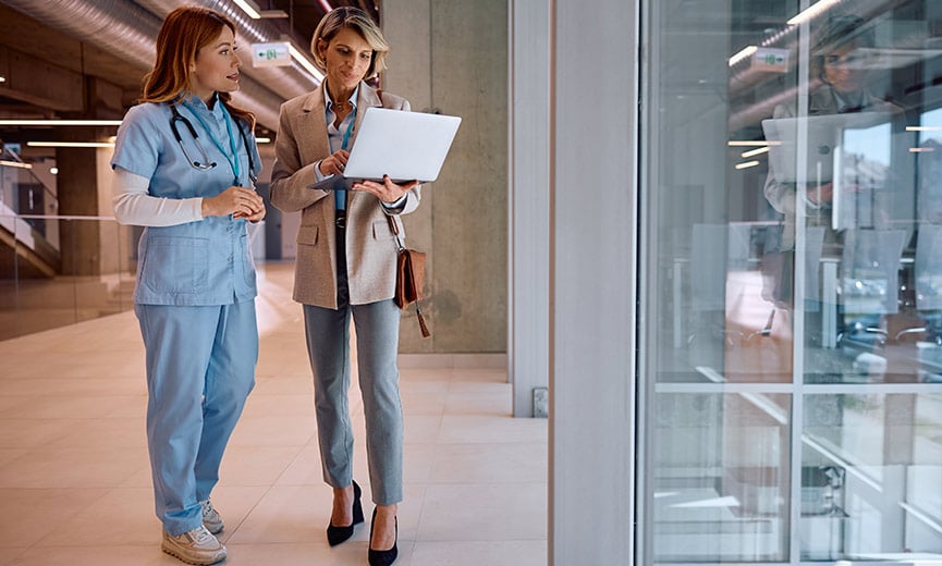 Human Resources and Medical Professional Chatting