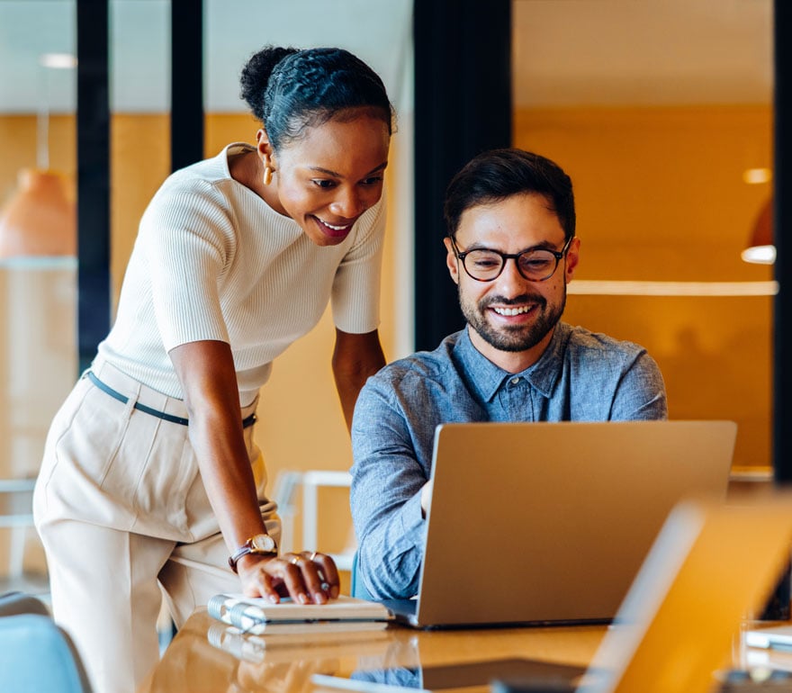 Employees looking at a computer