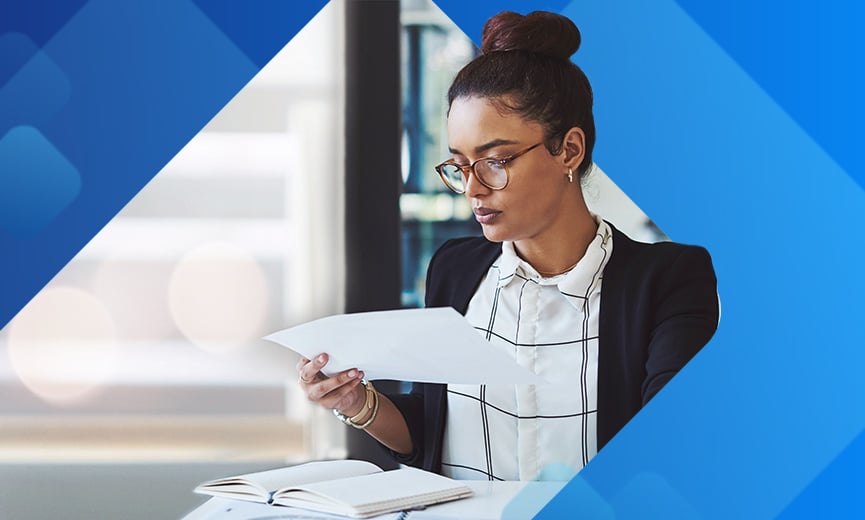 Business owner looking at an employee's W4