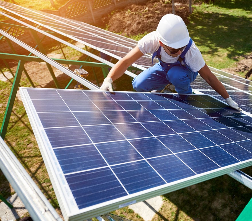A man installing solar panels