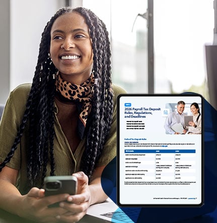 Business owner smiling as she is on her phone