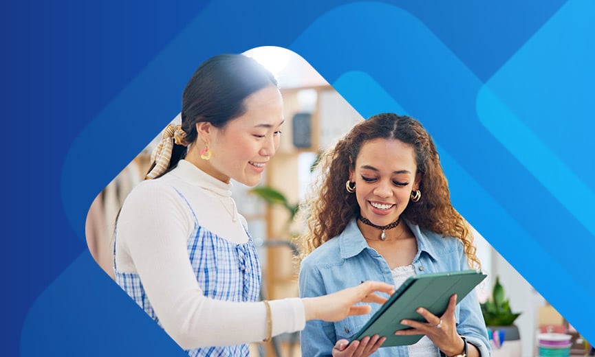 Employee and business owner looking at timesheet on ipad