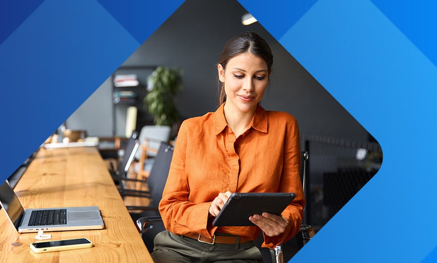 Woman using AI on her tablet in the workplace