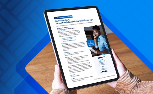 Image of a person holding a tablet reading about HR & Payroll automation