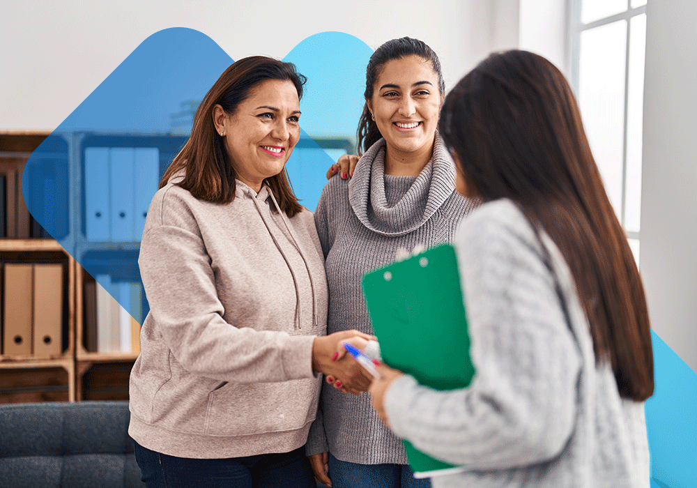 Counselors at a drug use treatment facility discuss a patient plan.