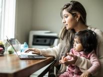 mother working with child on lap