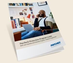 Cover of the eBook showing man working on his laptop at his business