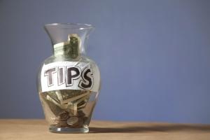 differences between tips and service charges