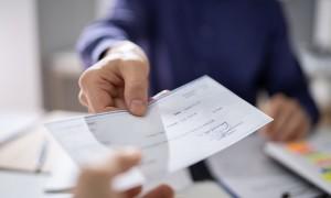 An employer uses a traditional check to pay an employee