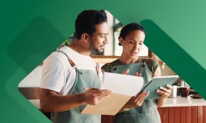 Employee filling out new hire paperwork with manager