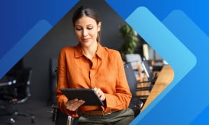 Professional woman checking data on tablet