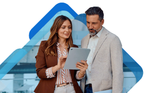 Two business people looking at a payroll calendar on their tablet