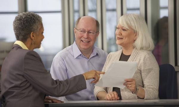 Financial advisor discussing social security with an older couple
