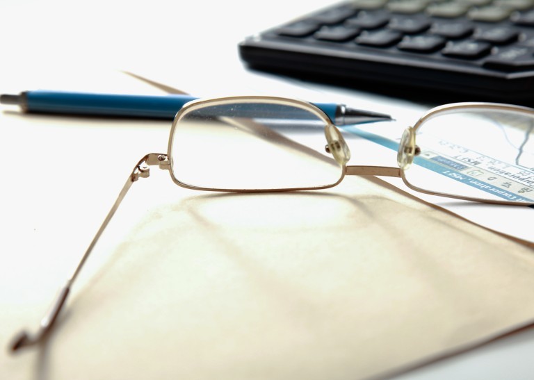 an accountant's glasses on a table 