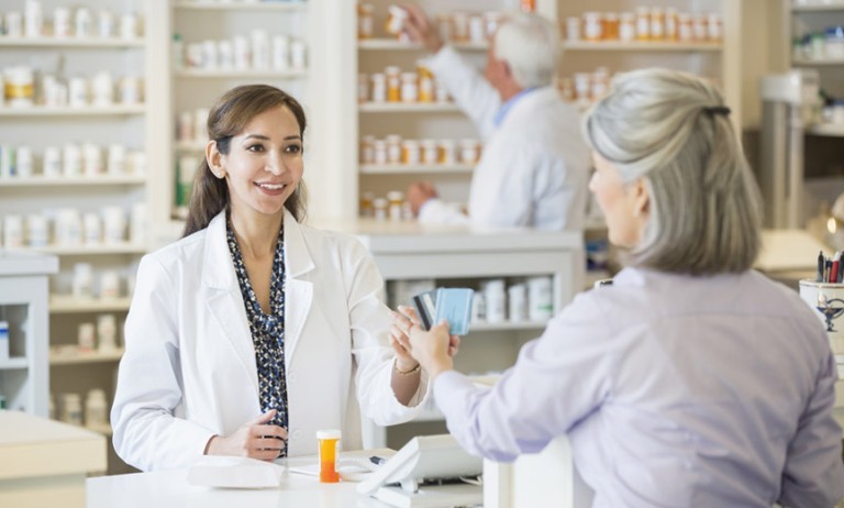 Women talking to pharmacist 