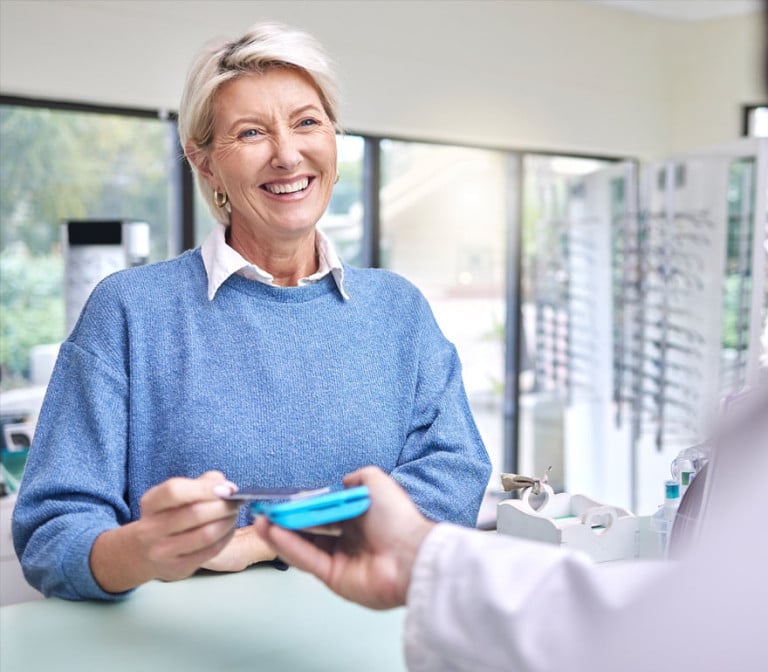 An employee paying for glasses using her HSA