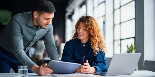 Employees at a large business working together