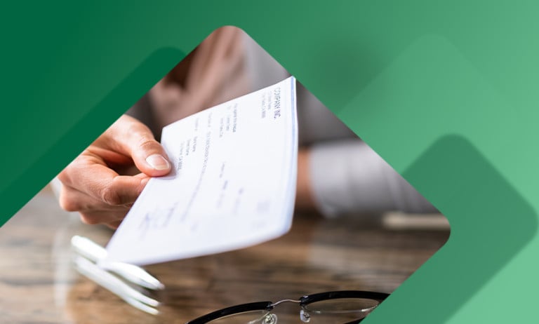 Small business owner handing over a check