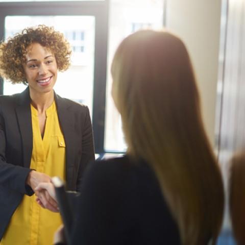 Two woman discussing Hiring Strategies for Small and Mid-Sized Employers