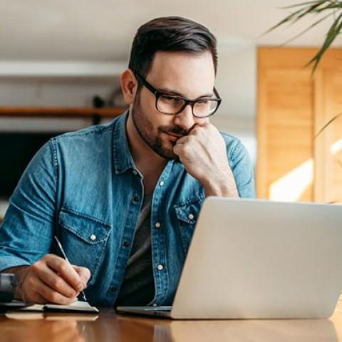 HR manager working in front of his laptop from home