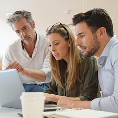 employees reviewing retirement changes from the secure act 2.0