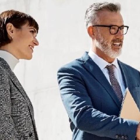two business professionals discussing career advancement opportunities