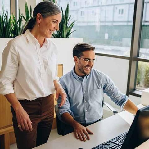 a manager walking her new hire through the employee onboarding process