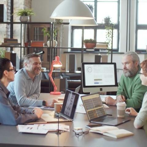 A busy office with employee working together