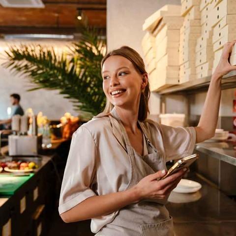a smiling restaurant worker