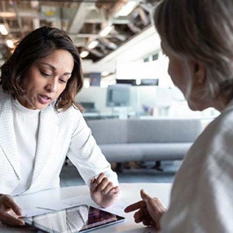 financial advisor with client reviewing documents