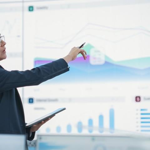 woman presenting retirement projections