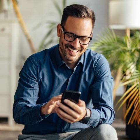 A business owner using his mobile device
