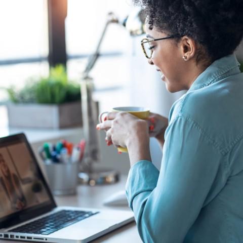 Small Business owner in a video call about outsourcing employee benefits