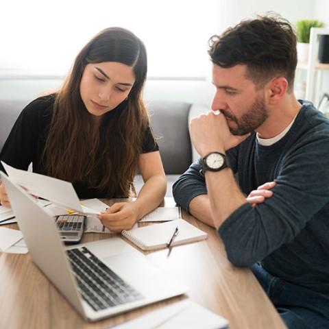 Young couple doing retirement planning