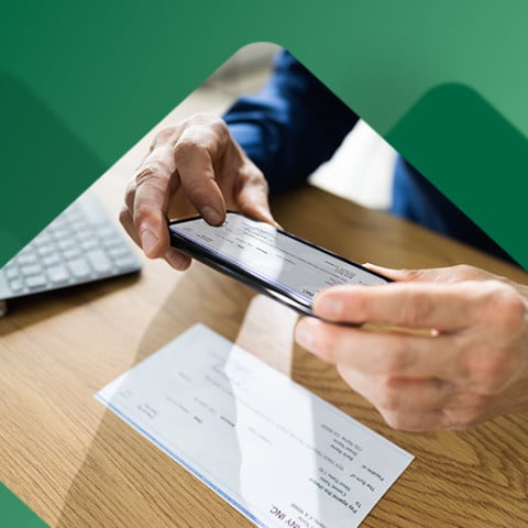 Person cashing a check digitally using their phone